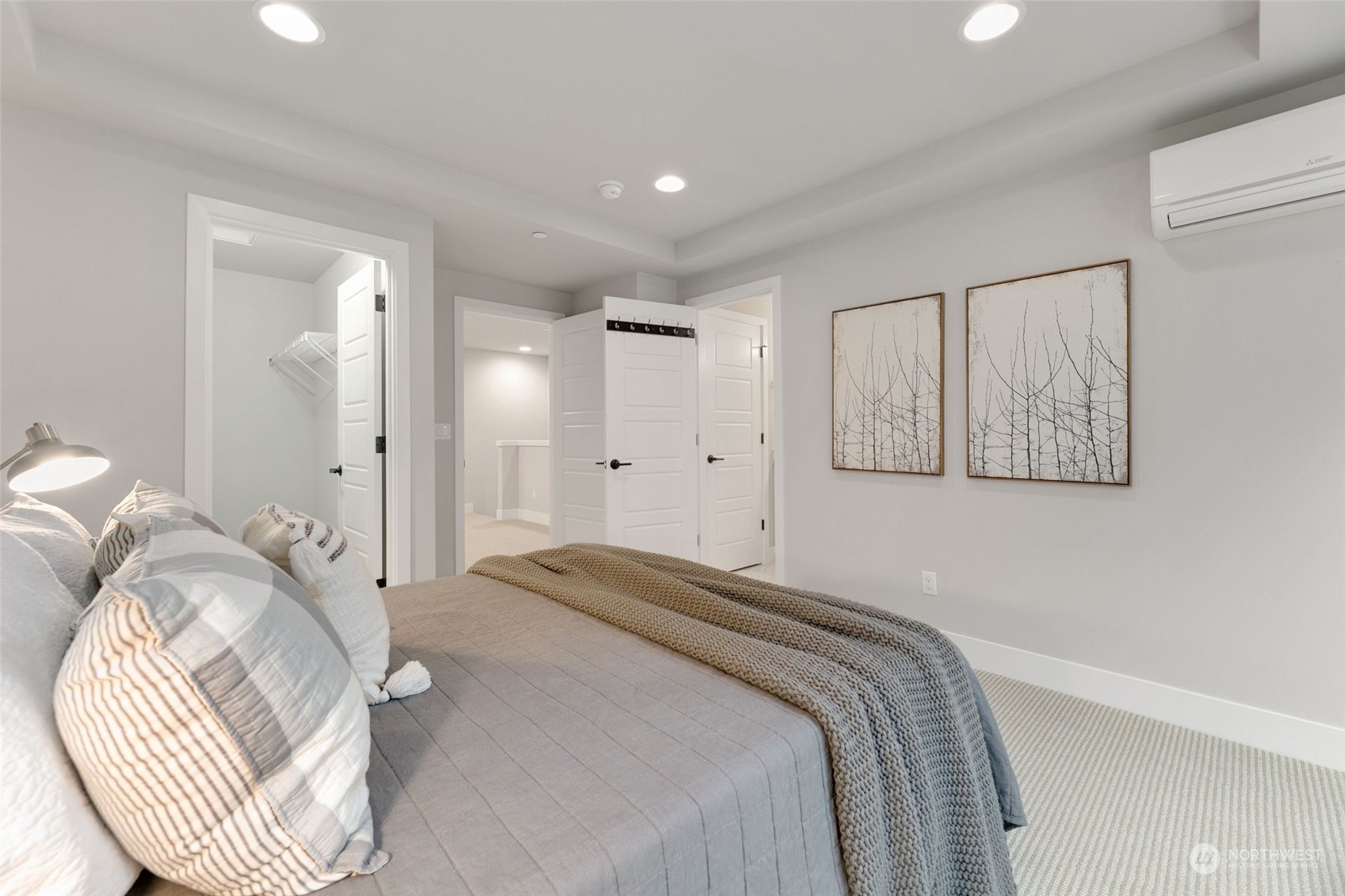23626 5th Avenue Southeast, Unit C Bothell, WA 98021 - Photo 22 of 39 a bedroom with a bed and a mirror