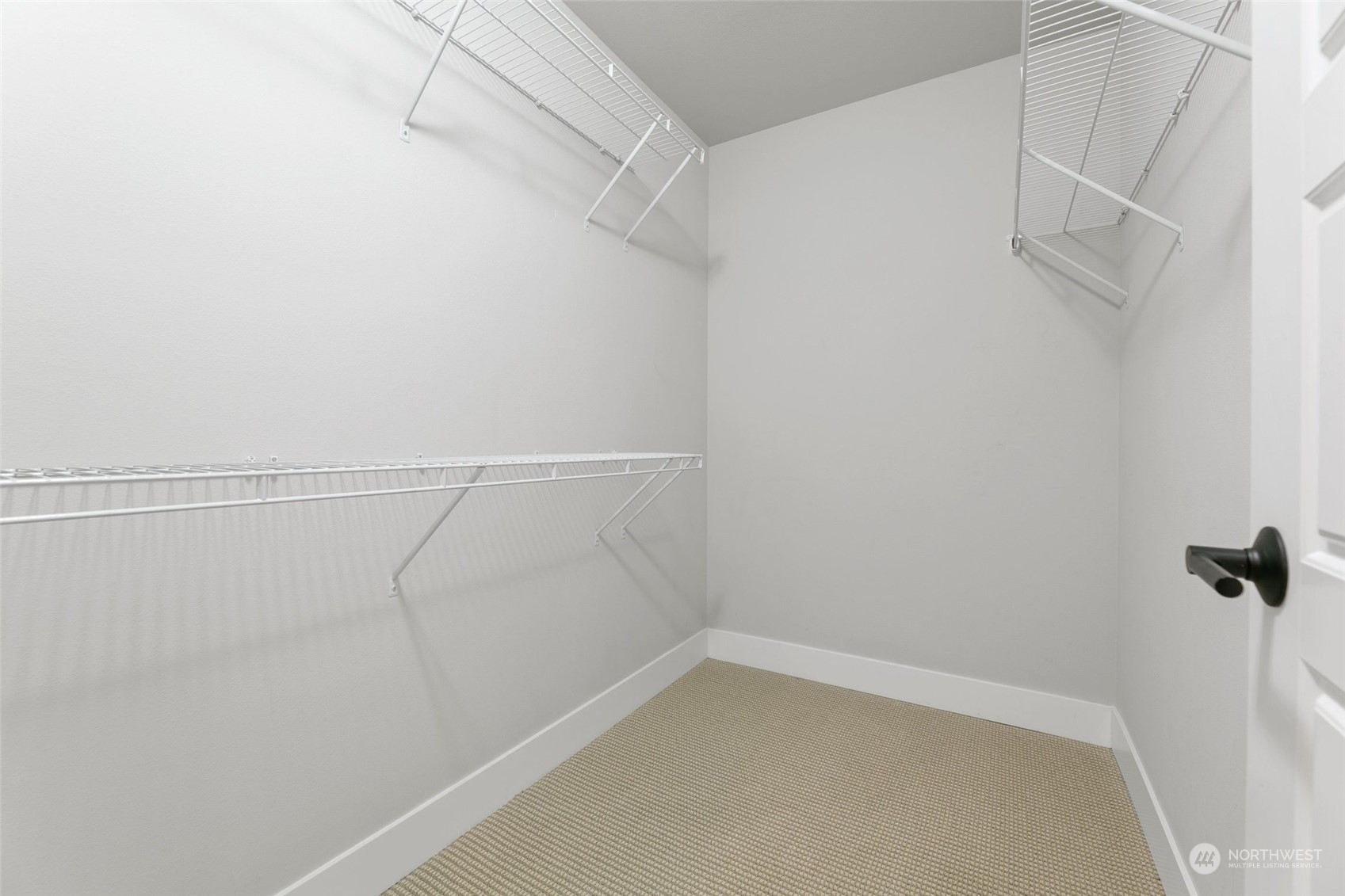 23626 5th Avenue Southeast, Unit C Bothell, WA 98021 - Photo 23 of 39 a view of a room with racks on the wall