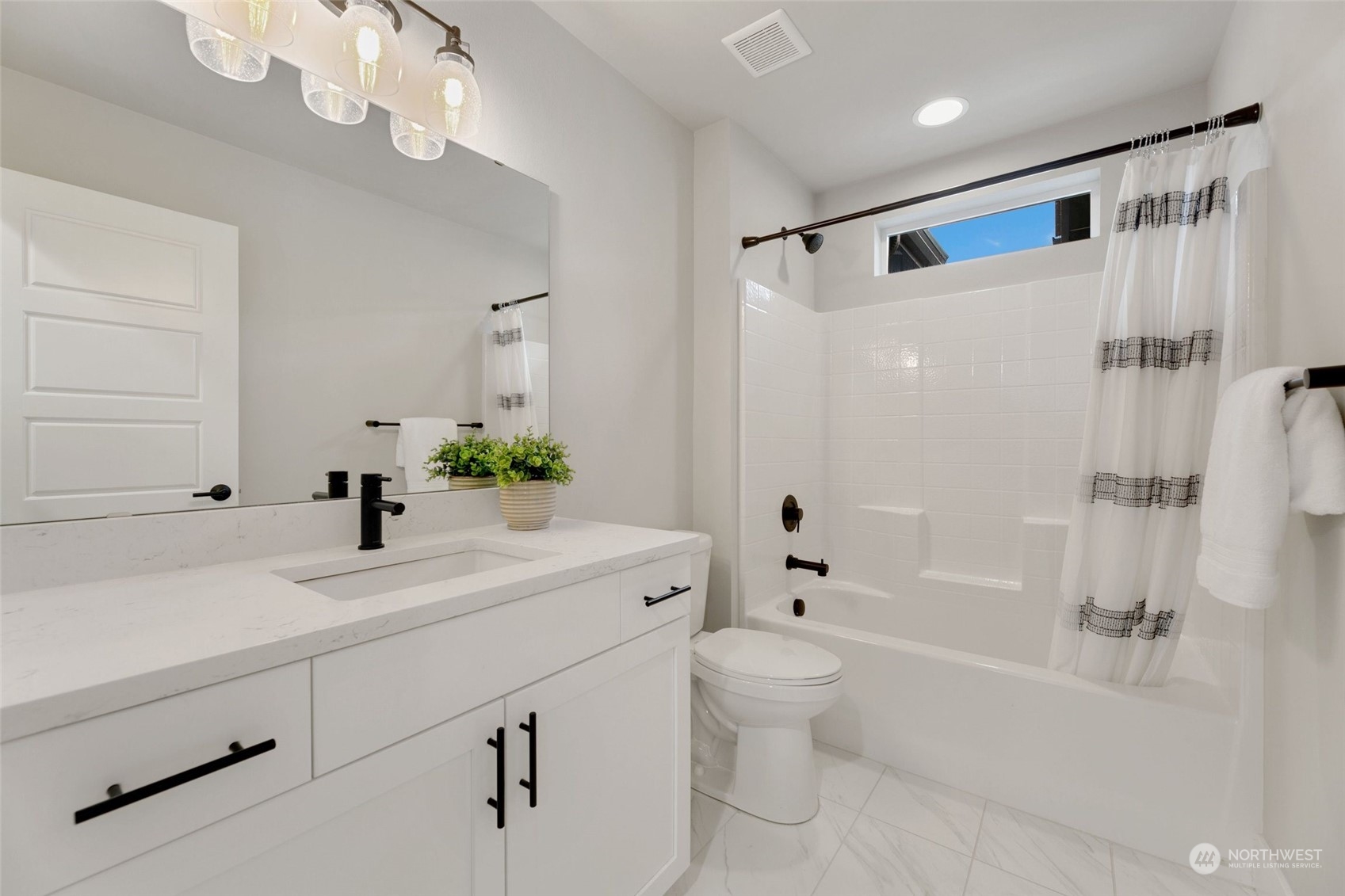 23626 5th Avenue Southeast, Unit C Bothell, WA 98021 - Photo 27 of 39 a bathroom with a sink a toilet and a bathtub