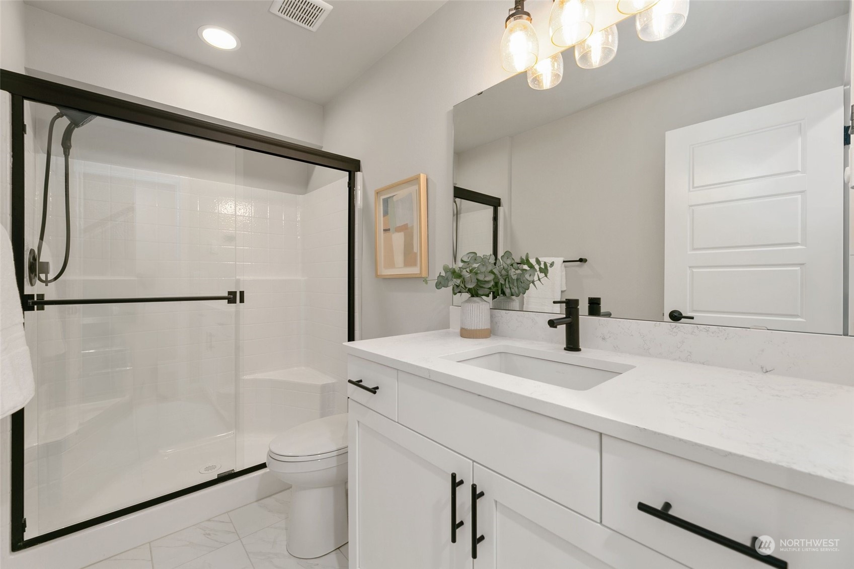23626 5th Avenue Southeast, Unit C Bothell, WA 98021 - Photo 32 of 39 a bathroom with a sink a toilet and a mirror