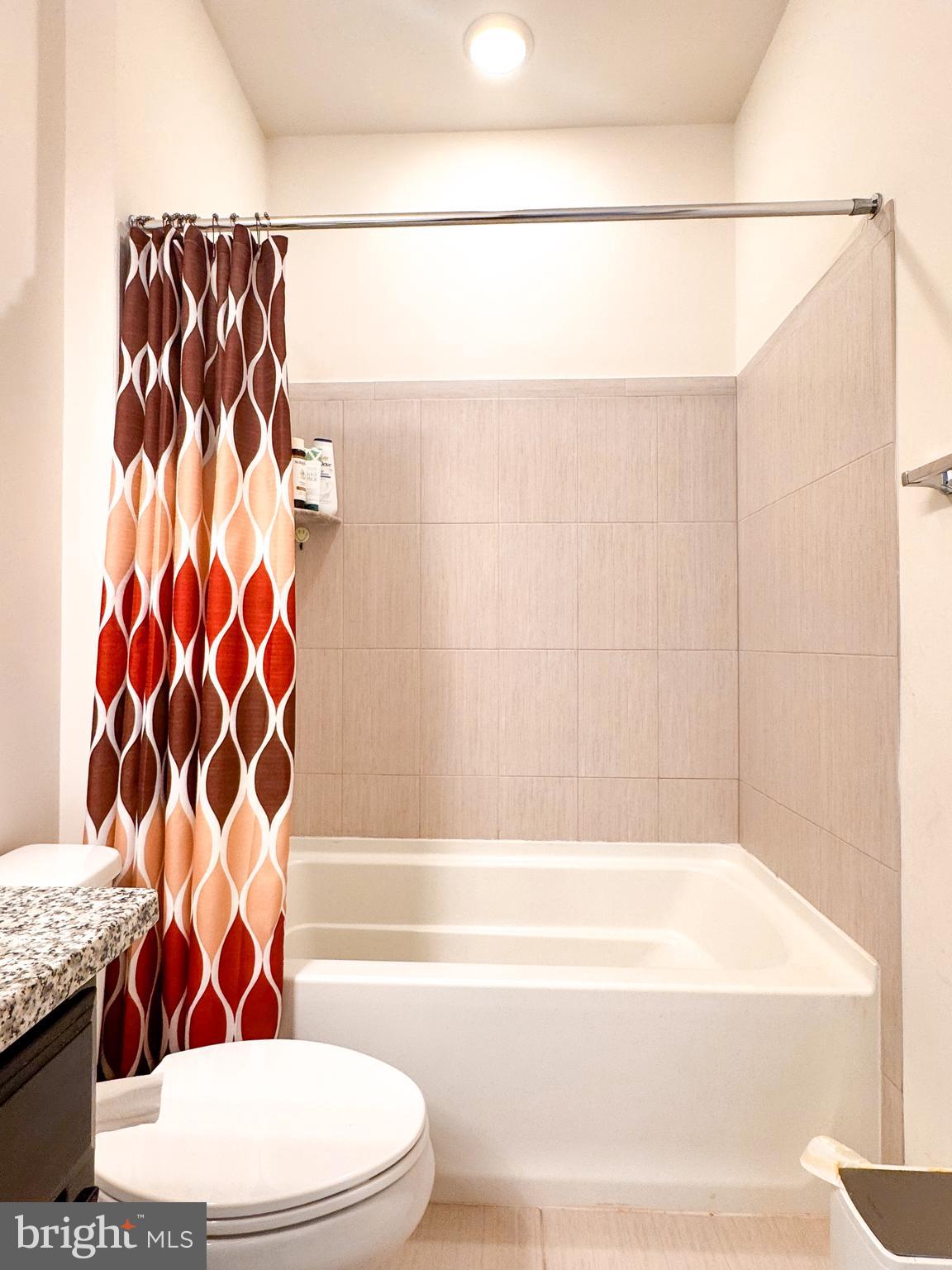 25419 Reed Orchard Terrace Chantilly, VA 20152 - Photo 44 of 47 a bathroom with a bathtub and shower