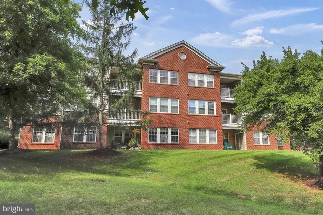 a front view of a building with garden