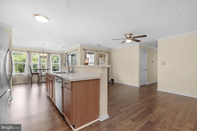 a view of living room with furniture and a chandelier