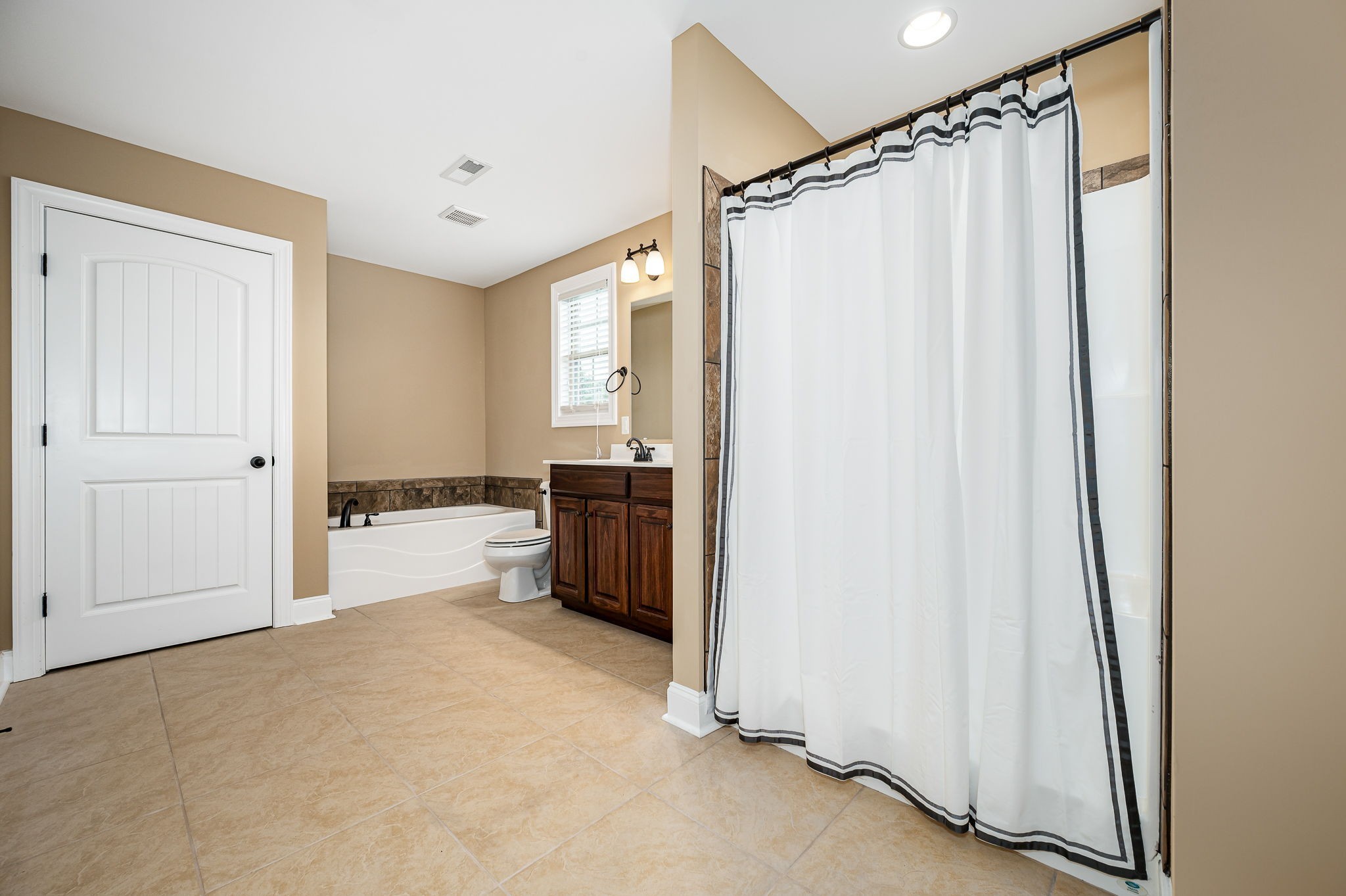 2816 Lightning Bug Drive Murfreesboro, TN 37129 - Photo 14 of 23 a view of a bathroom with tub and sink