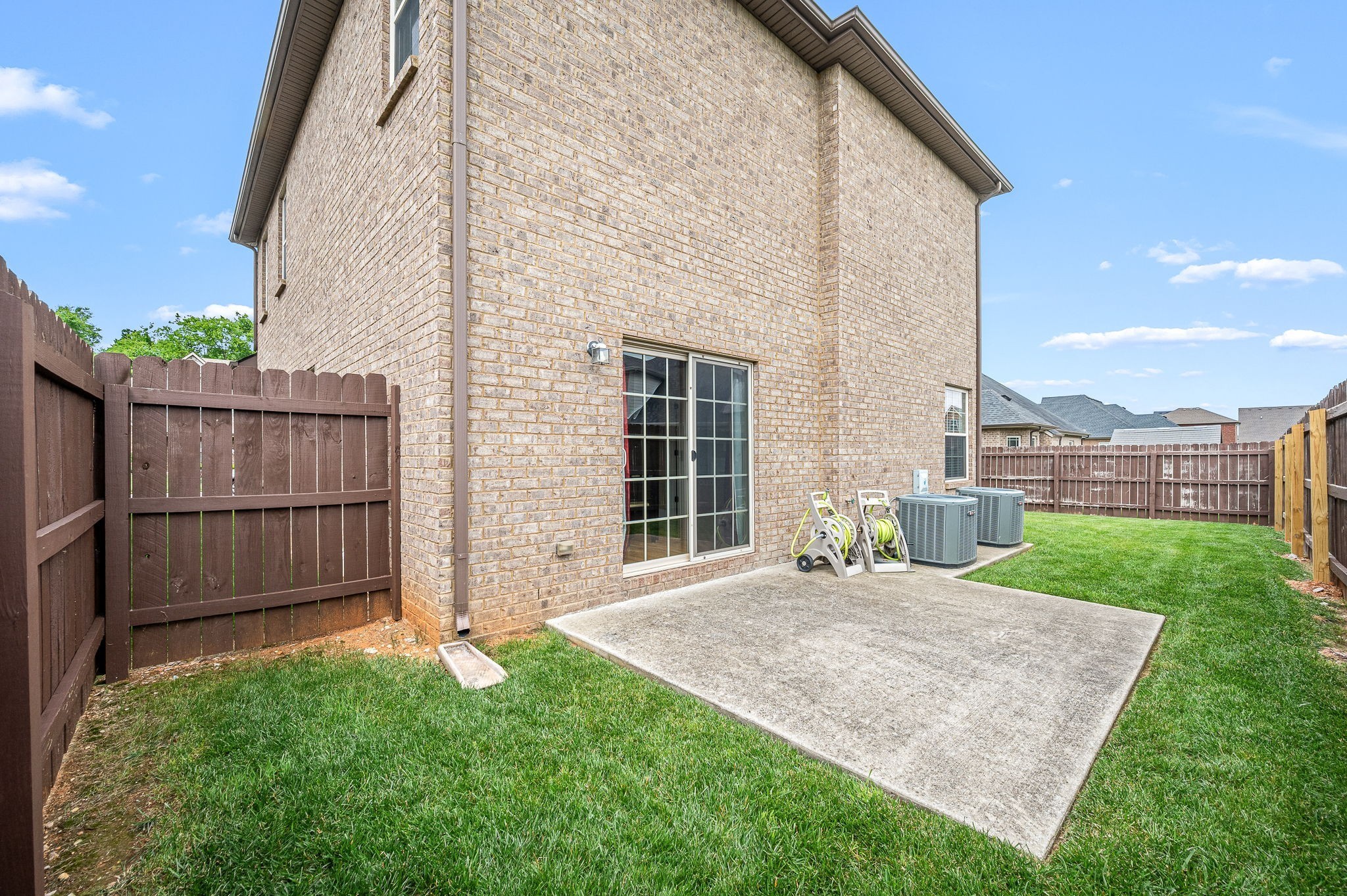2816 Lightning Bug Drive Murfreesboro, TN 37129 - Photo 20 of 23 a view of a house with a yard and wooden fence
