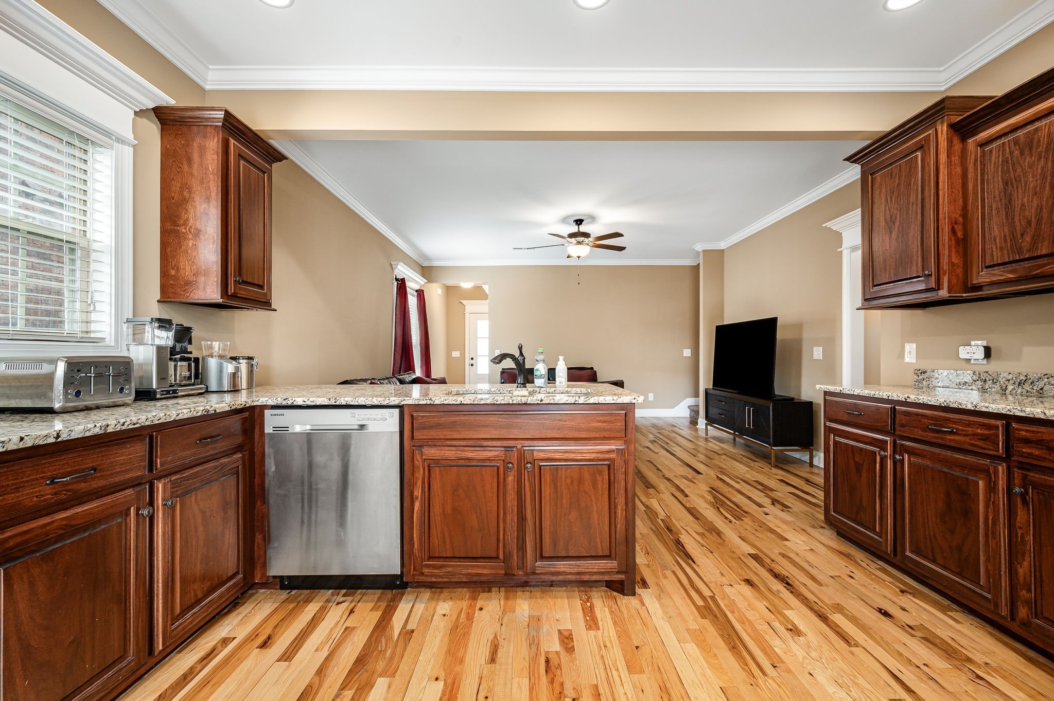 2816 Lightning Bug Drive Murfreesboro, TN 37129 - Photo 7 of 23 a large kitchen with wooden floors and stainless steel appliances