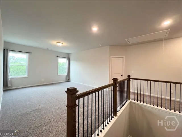 a view of a hallway with windows