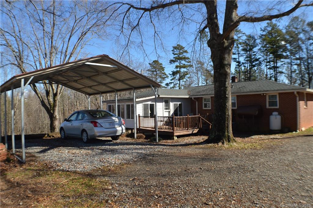 2395 Cove Road Rutherfordton, NC 28139 - Photo 22 of 25 a car parked in front of a house