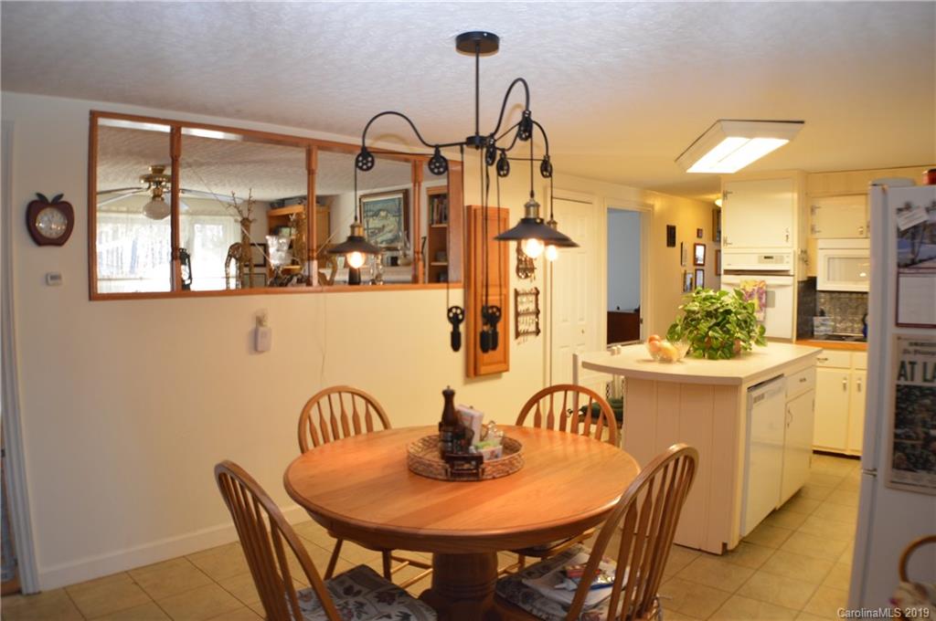 2395 Cove Road Rutherfordton, NC 28139 - Photo 8 of 25 a dining room with furniture and window
