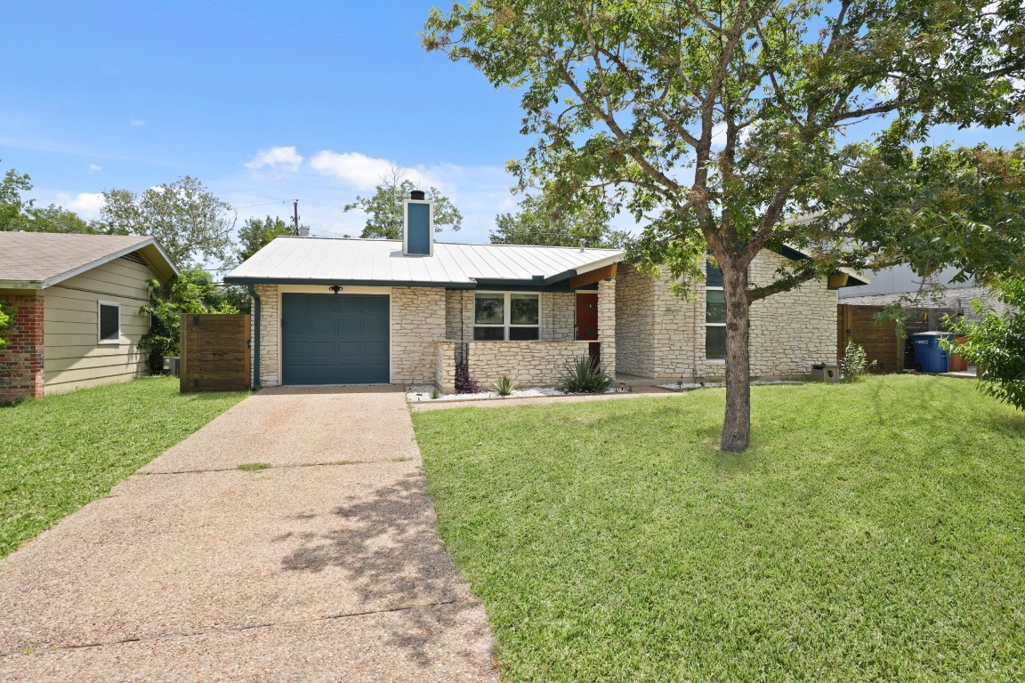 8507 Spearman Drive Austin, TX 78757 - Photo 1 of 1 front view of a house with a yard