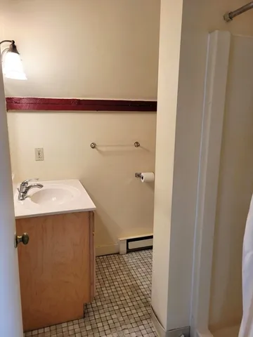 a bathroom with a sink and mirror