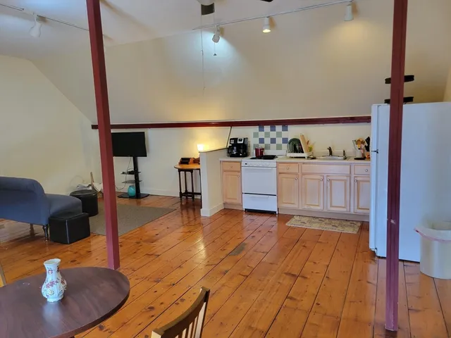 a kitchen with sink and cabinets
