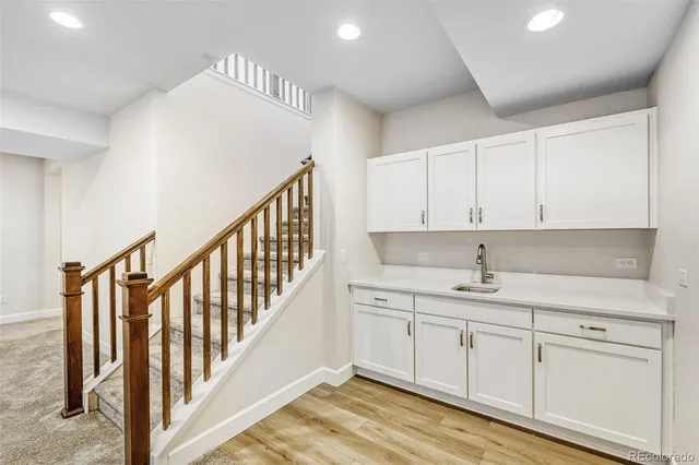 a kitchen with white cabinets