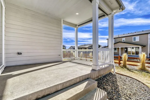 a view of a balcony with chairs