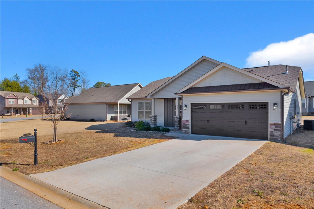 155 Norfolk Circle Anderson, SC 29625 - Photo 23 of 33 This charming residence features a spacious driveway and an attached garage, offering convenience and curb appeal.