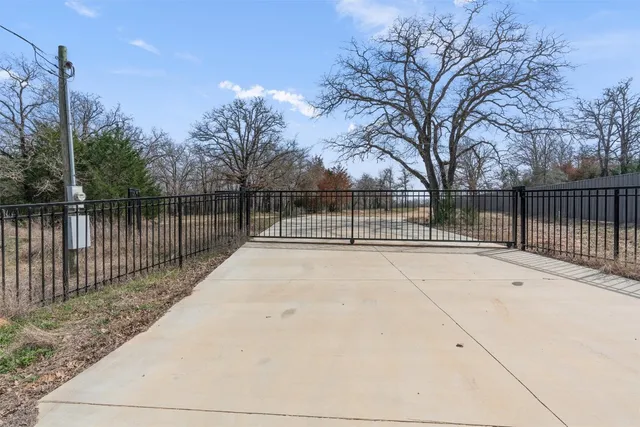 a view of yard covered with snow in front of house