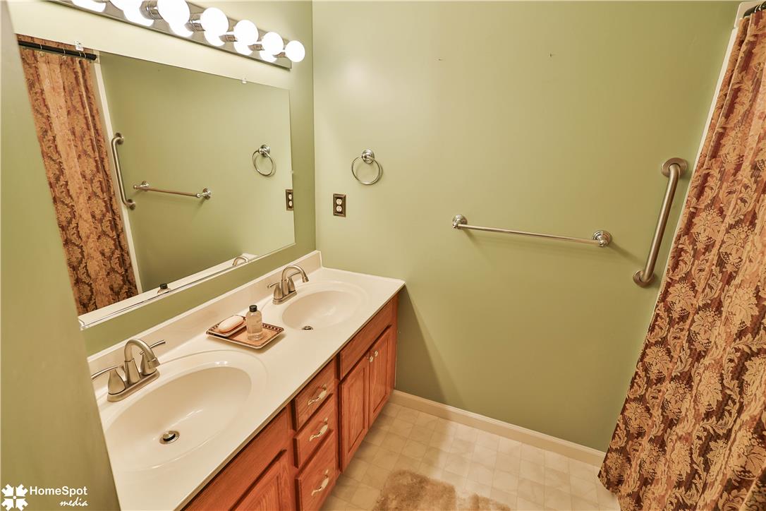 507 Howertown Road Northampton, PA 18067 - Photo 32 of 46 Double vanity sinks and bright lighting enhance this well-appointed bathroom space.