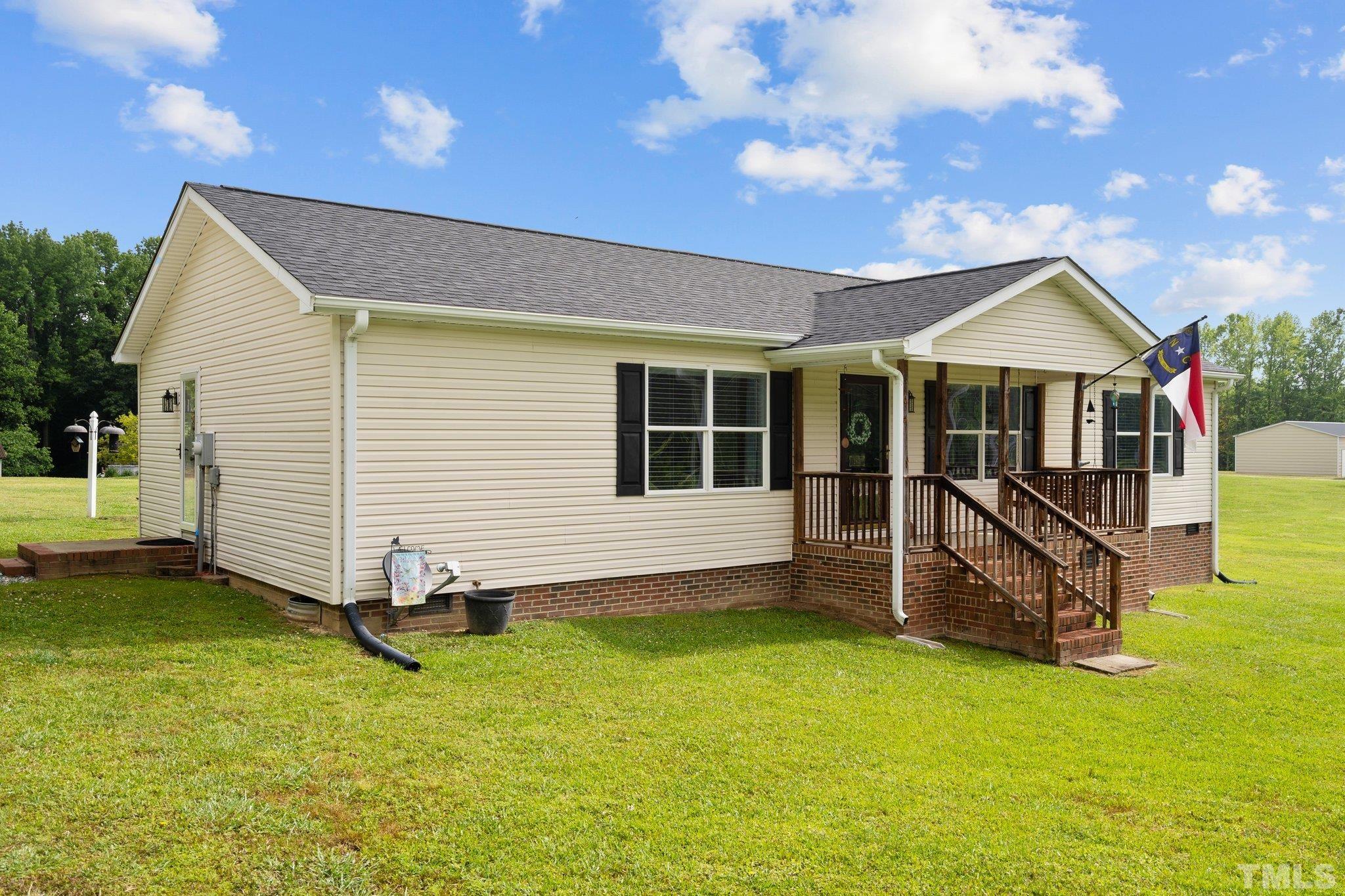 2613 Old Allensville Road Roxboro, NC 27574 - Photo 3 of 35 a view of a house with a yard balcony and a tree