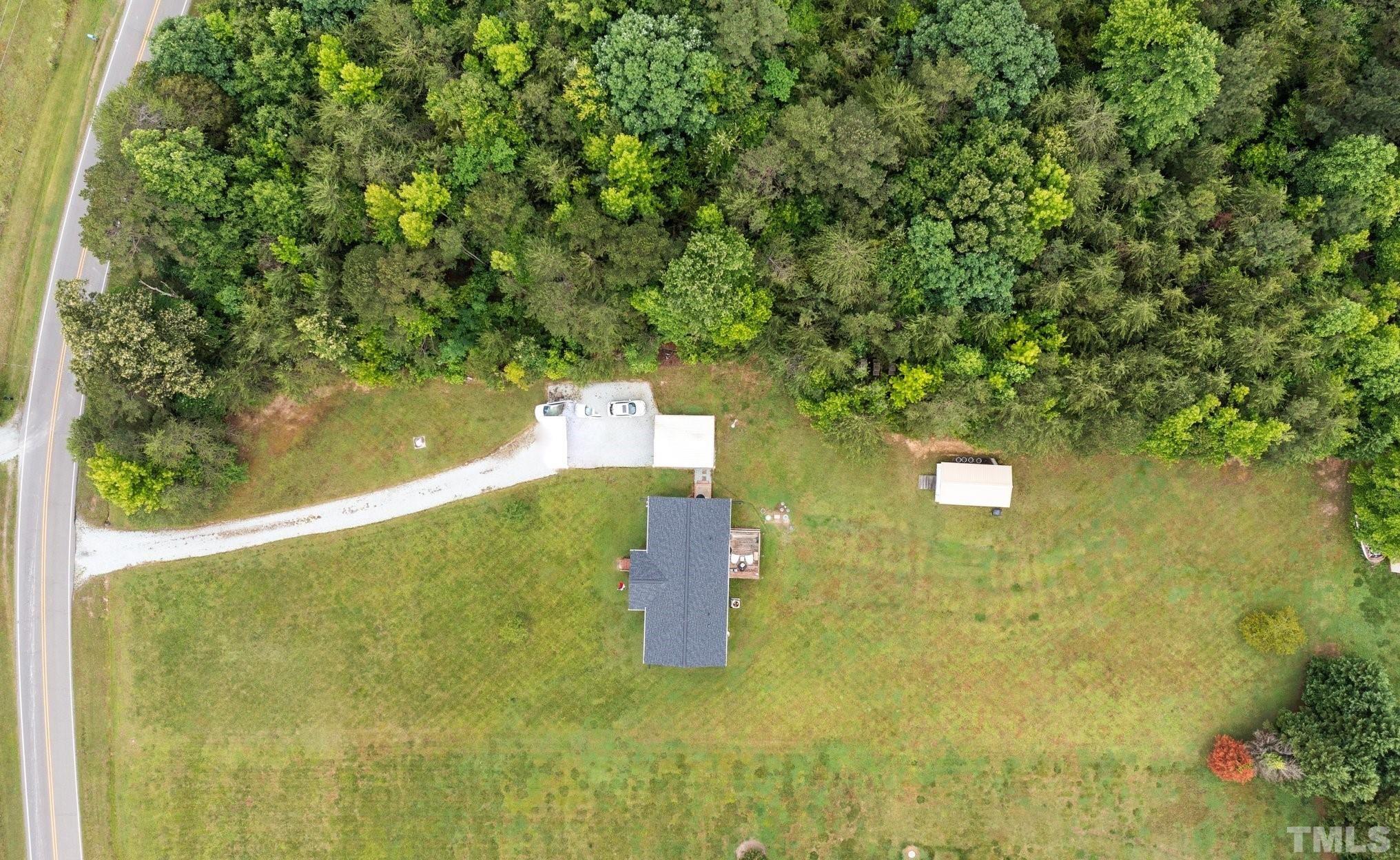 2613 Old Allensville Road Roxboro, NC 27574 - Photo 33 of 35 a view of a yard with a tree