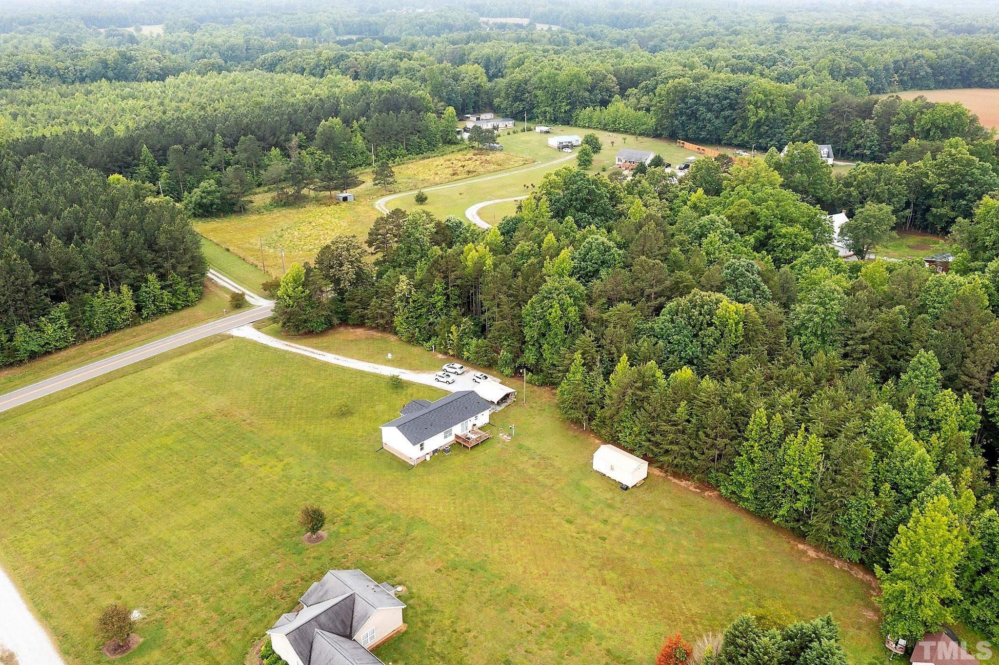 2613 Old Allensville Road Roxboro, NC 27574 - Photo 34 of 35 a view of a swimming pool and lake