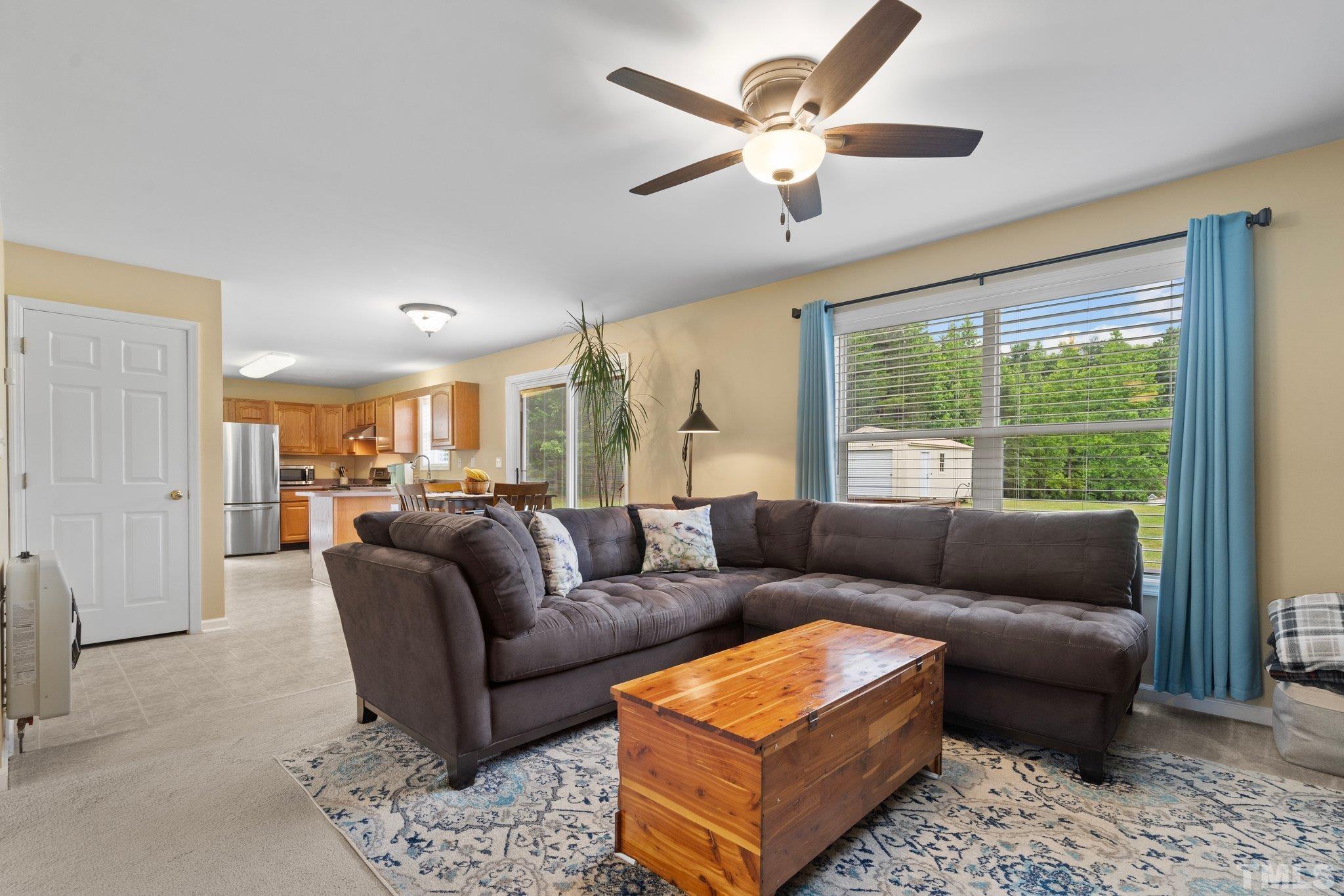 2613 Old Allensville Road Roxboro, NC 27574 - Photo 10 of 35 a living room with furniture and a large window