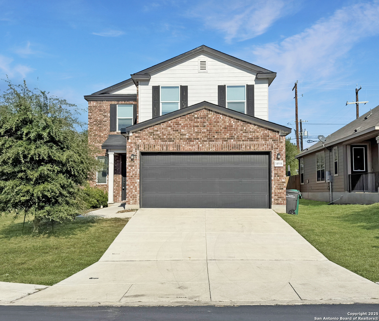 a front view of a house with yard