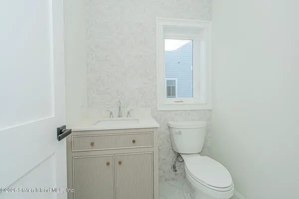 a view of a backyard with plants and a garden