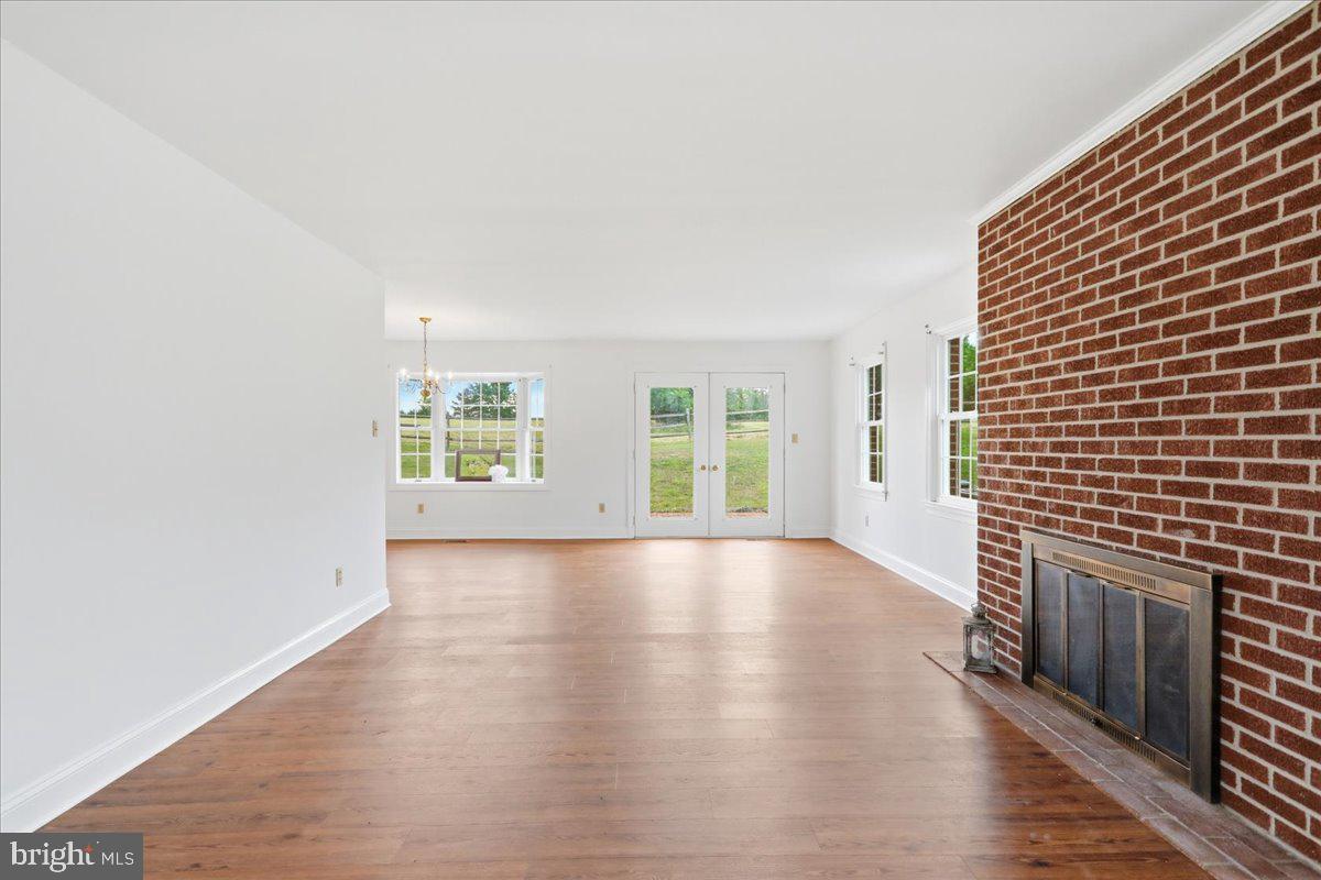 2447 Headquarters Road Edinburg, VA 22824 - Photo 11 of 58 Living Room wood burning fireplace