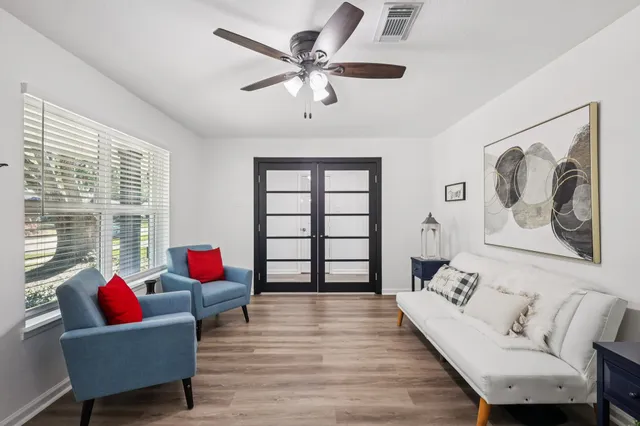 a living room with furniture or window and a chandelier