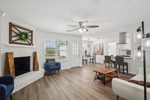 a kitchen with white cabinets and appliances