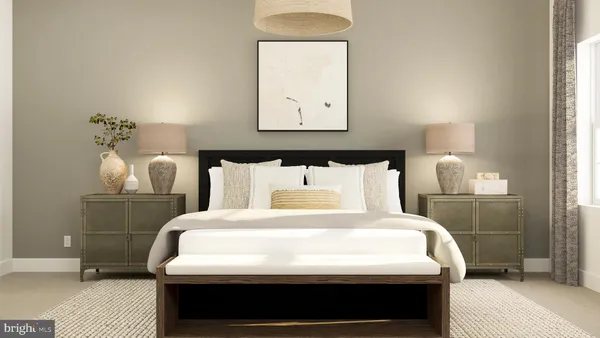 a bedroom with a bed a mirror and lamp