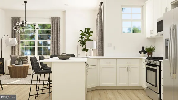 a kitchen with a table chairs refrigerator and microwave