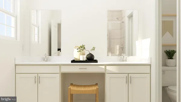 a bathroom with a toilet and a mirror