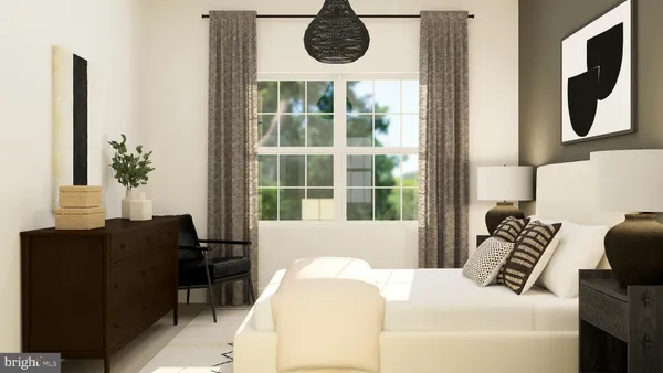 a bedroom with bed and a clock on the wall