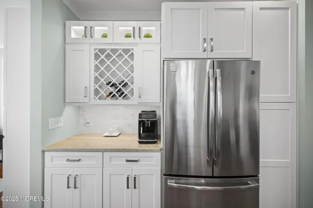 a kitchen with appliances and cabinets