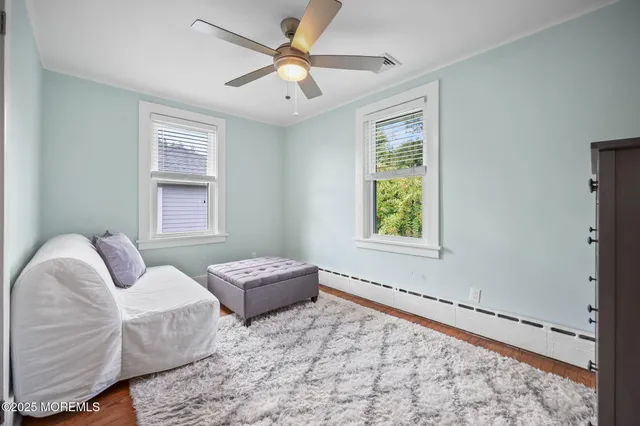 a bedroom with furniture and a window