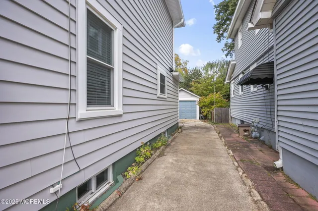 a view of house with backyard and garden