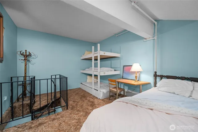 a bathroom with a sink mirror vanity and toilet