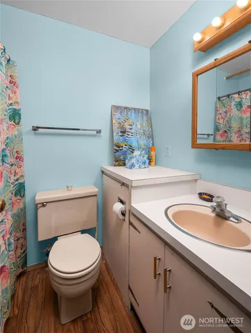 a room with chairs pool table and chairs