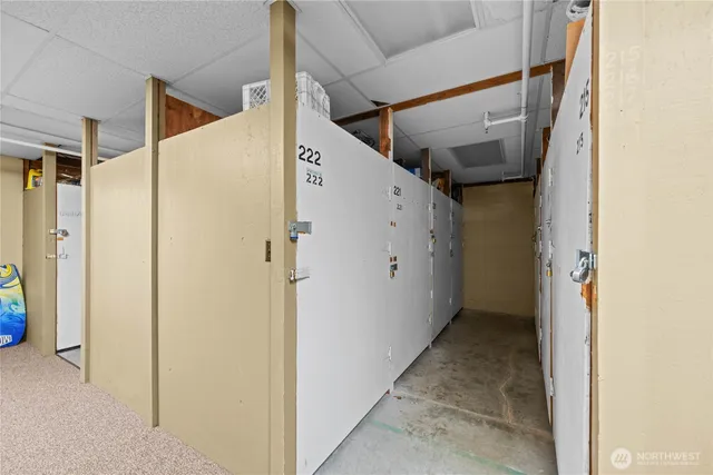 a view of a backyard with chairs and a table