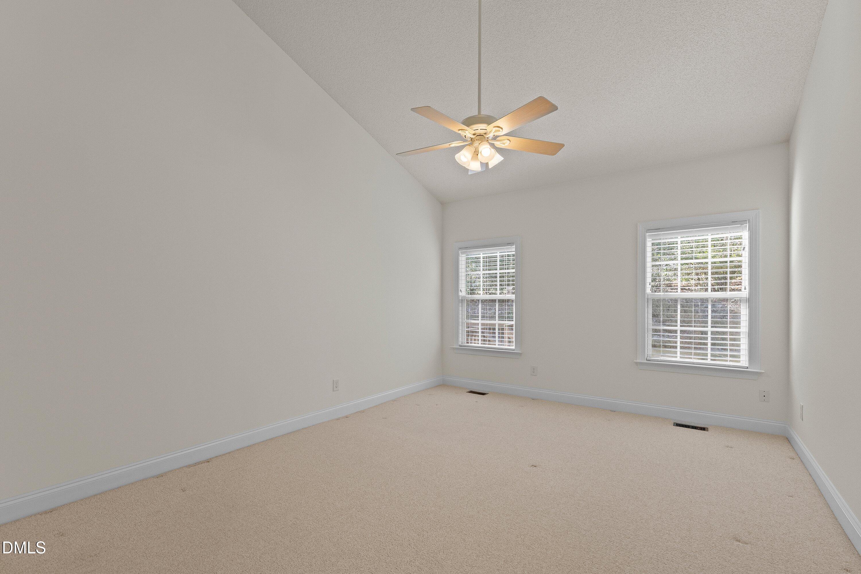 105 Rockport Ridge Way Cary, NC 27519 - Photo 31 of 43 an empty room with a window and a fan