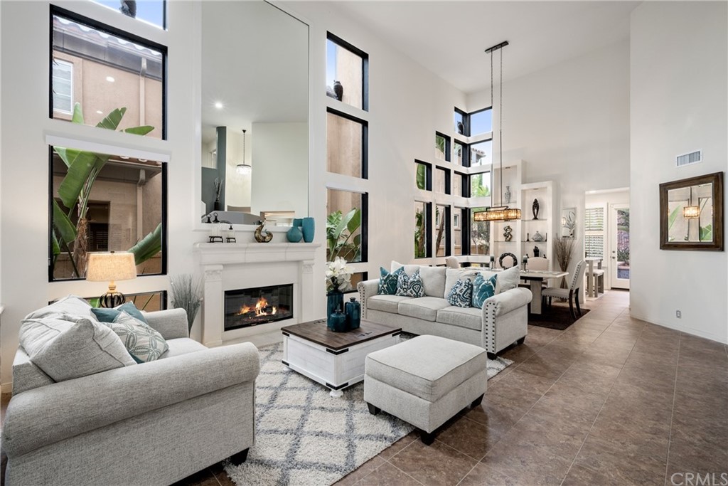 a living room with furniture fireplace and a flat screen tv