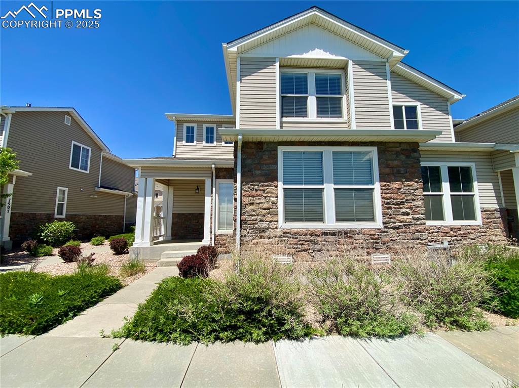 7513 Sandy Springs Point Fountain, CO 80817 - Photo 1 of 38 a front view of a house with a yard