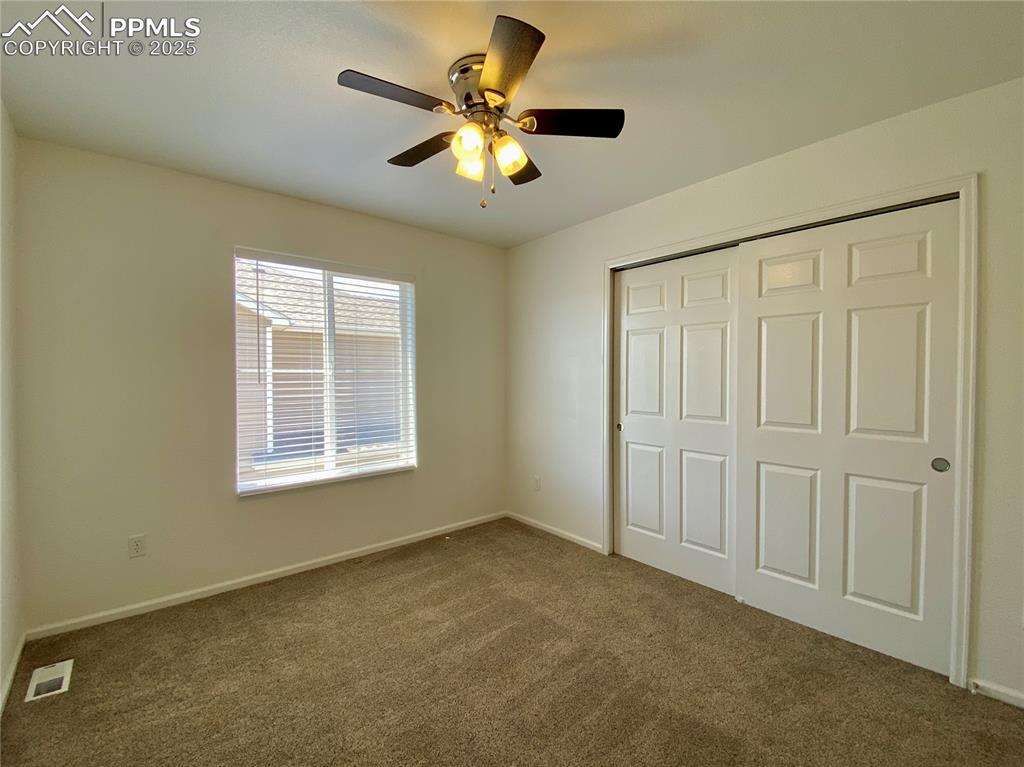 7513 Sandy Springs Point Fountain, CO 80817 - Photo 27 of 38 a view of an empty room with a window