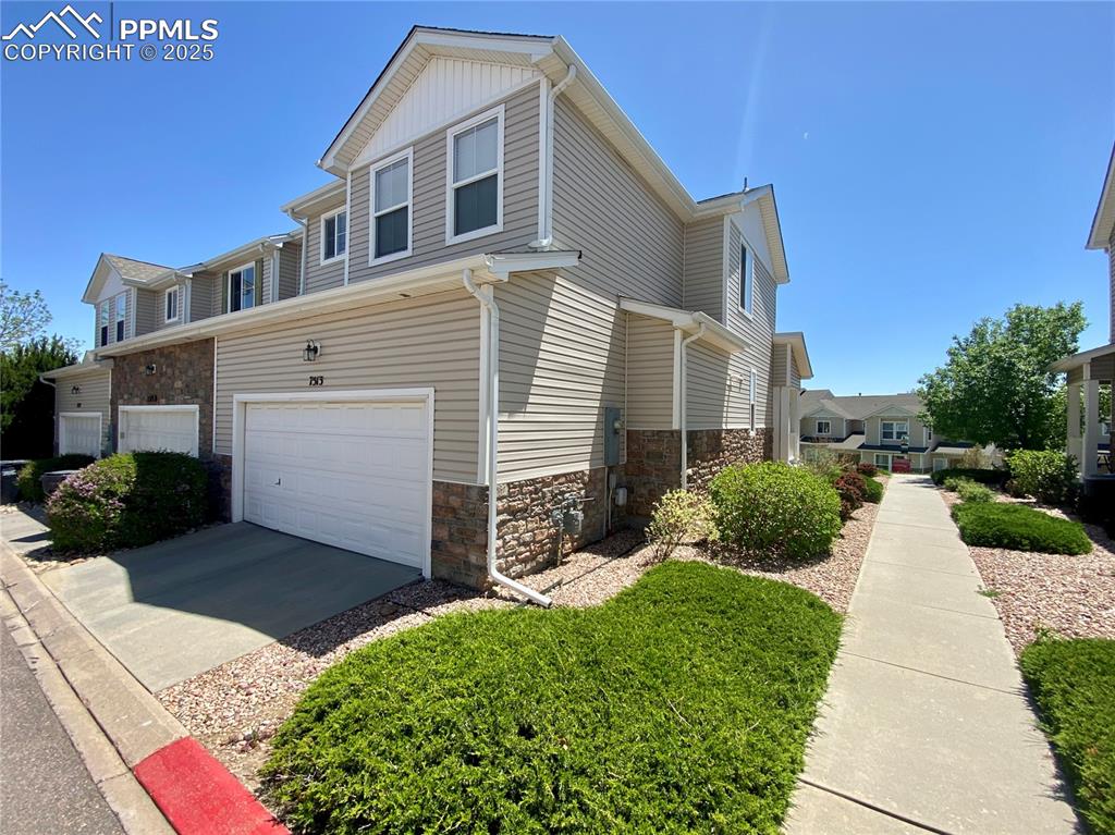 7513 Sandy Springs Point Fountain, CO 80817 - Photo 34 of 38 a front view of a house with a yard