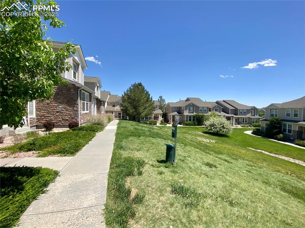 7513 Sandy Springs Point Fountain, CO 80817 - Photo 37 of 38 a view of a house with a yard