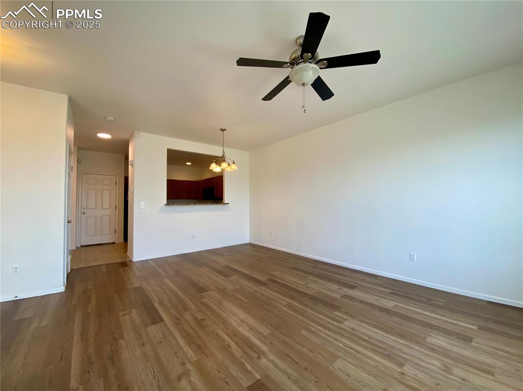 7513 Sandy Springs Point Fountain, CO 80817 - Photo 8 of 38 a view of a room with wooden floor and white walls