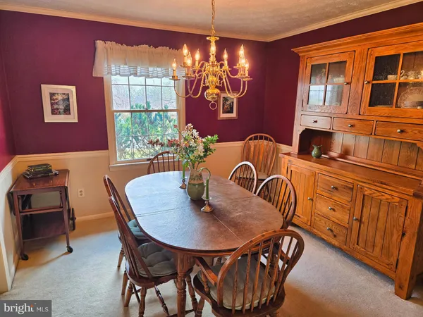 a view of a livingroom with furniture and a window
