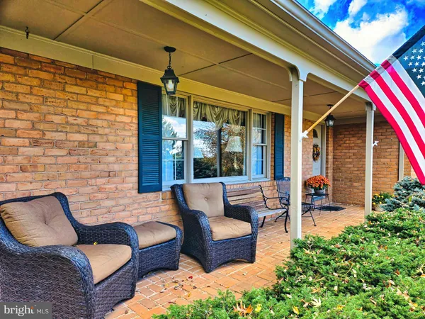 a outdoor living space with furniture and a potted plant