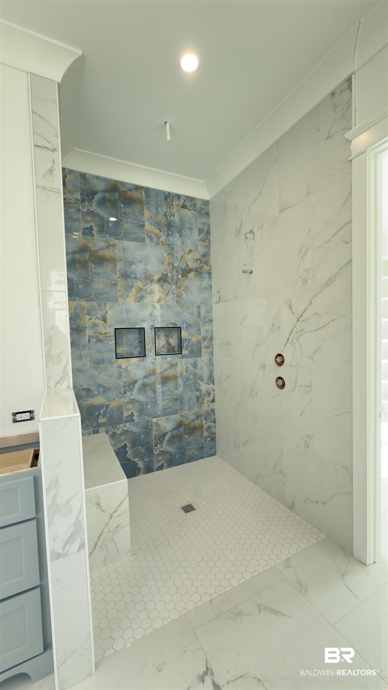 30327 River Road Orange Beach, AL 36561 - Photo 3 of 4 Bathroom featuring vanity, a tile shower, and crown molding